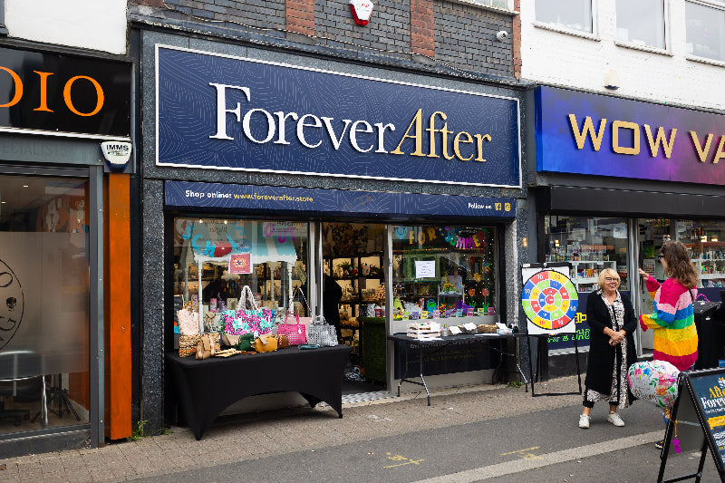 Storefront with 'Forever After' sign and people outside