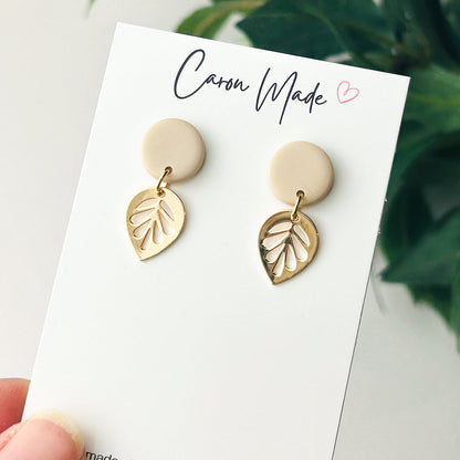 Small beige neutral stud and gold plated leaf earrings
