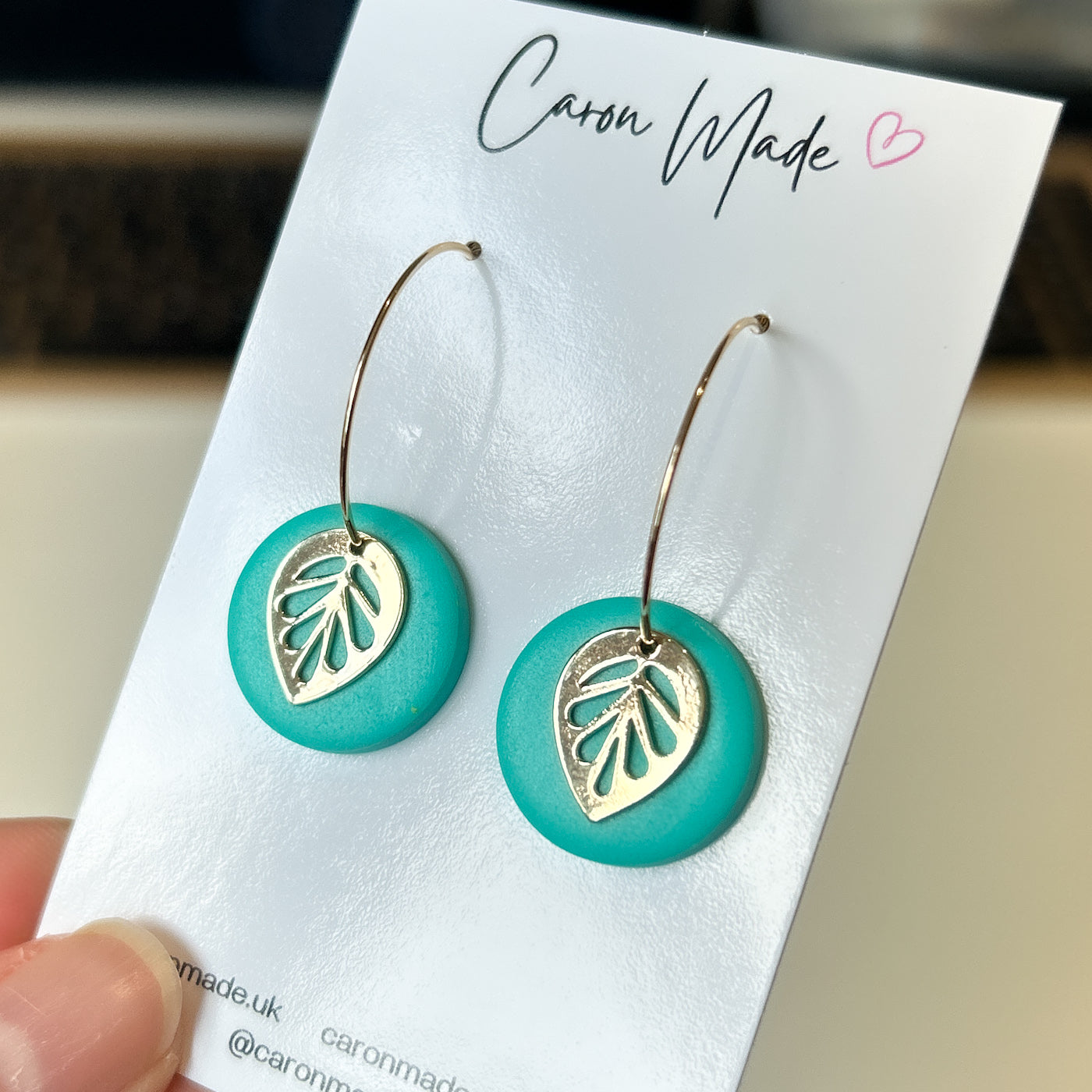 Hoop earrings with turquoise and leaf charm