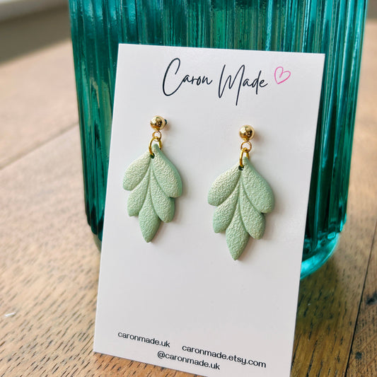 Light green floral shape earrings
